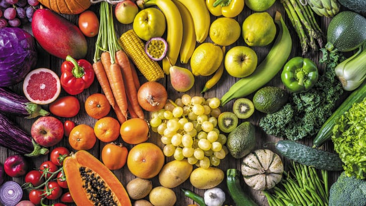 Raw fruits and vegetables from top view.