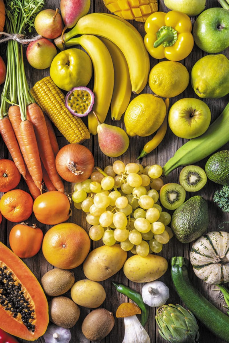 Raw fruits and vegetables from top view.