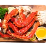 Cooked crab legs with melted butter.