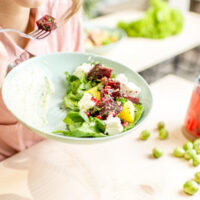 Close up view of plate with healthy salad.