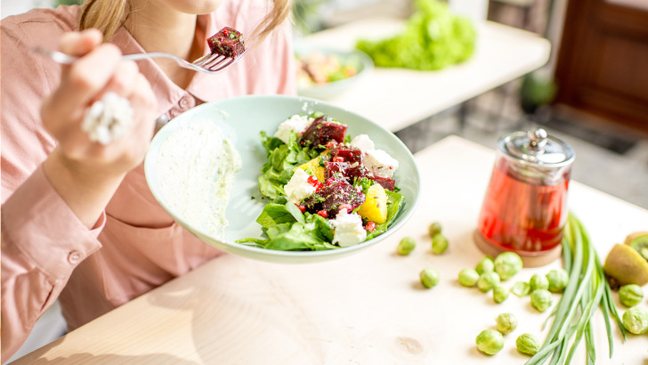 Close up view of plate with healthy salad.