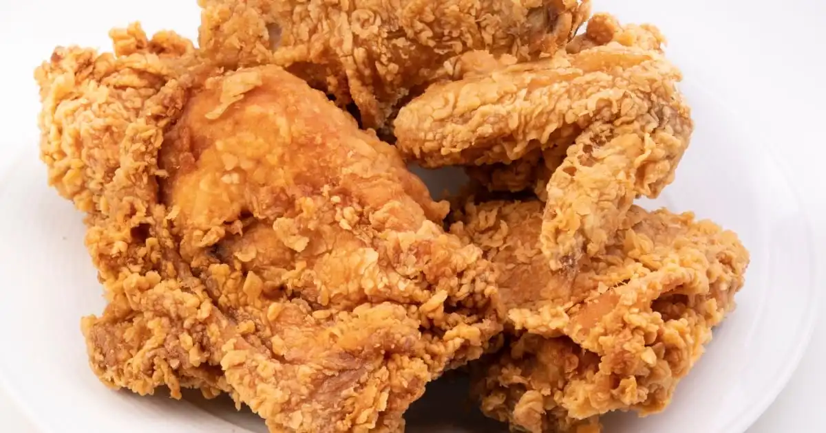 Fried chicken on white plate.