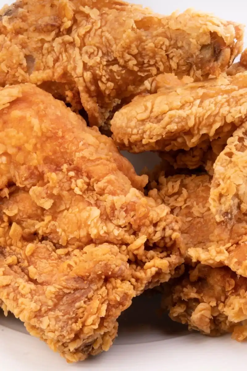 Fried chicken on white plate. 