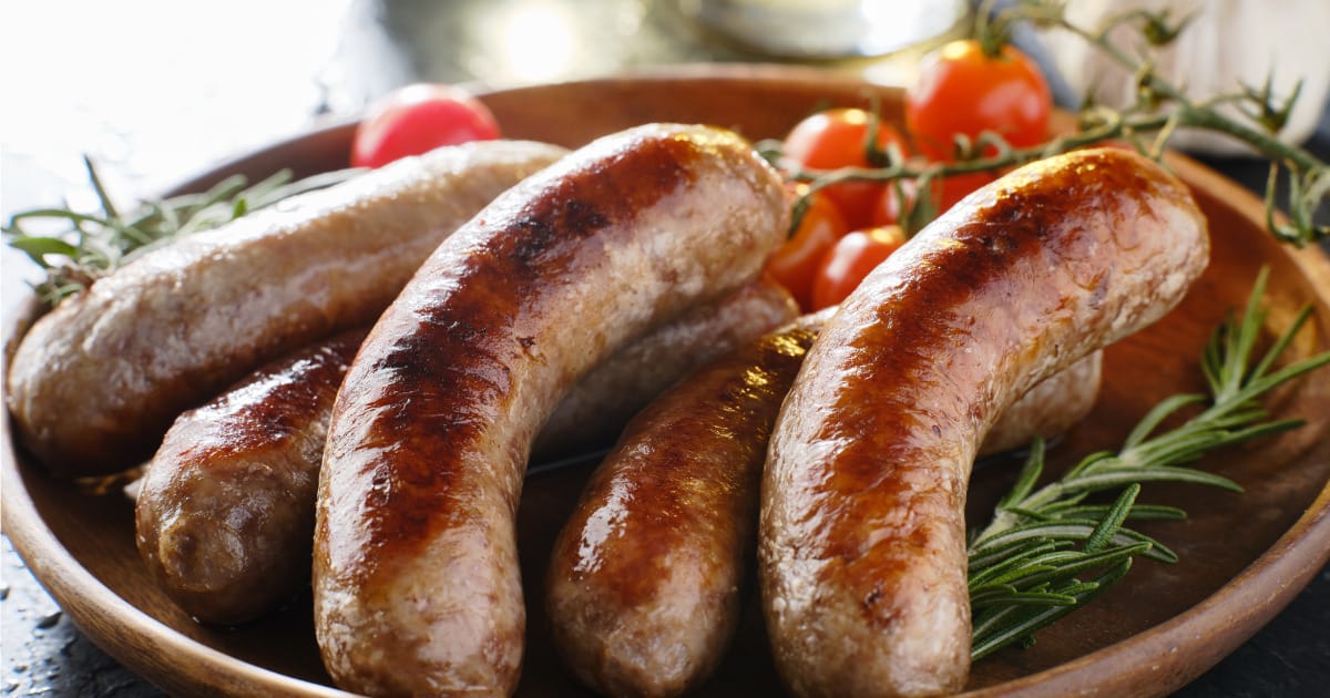 Bratwurst prepared on serving tray.