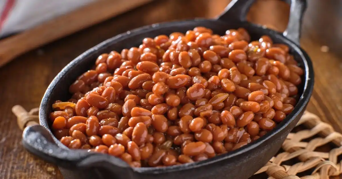 Baked beans in cast-iron skillet.