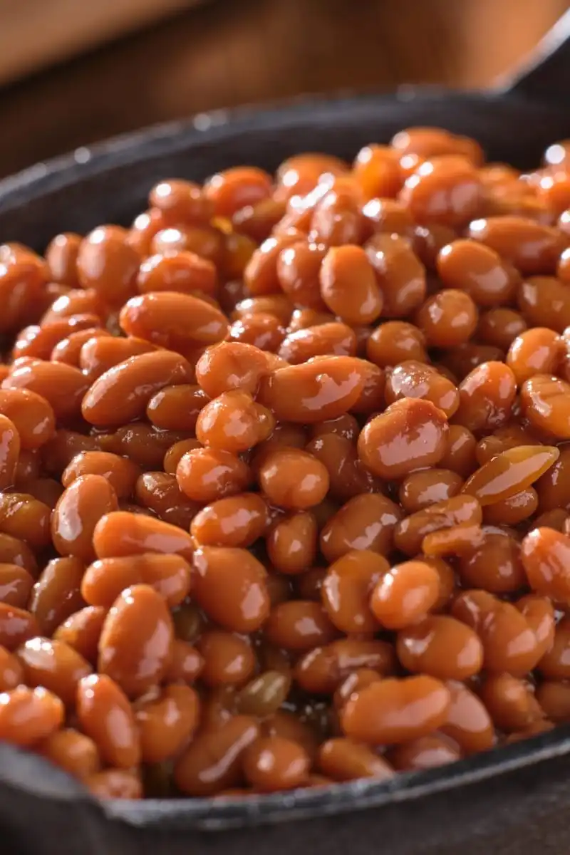 Baked beans in cast-iron skillet.