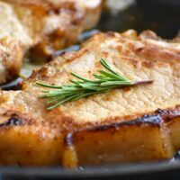 1-inch pork chops prepared on plate.