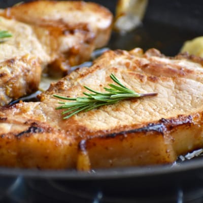 1-inch pork chops prepared on plate.