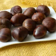 Ripe chestnuts close up. Raw Chestnuts for Christmas. Fresh sweet chestnut.