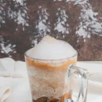 Cinnamon dolce in glass mug.