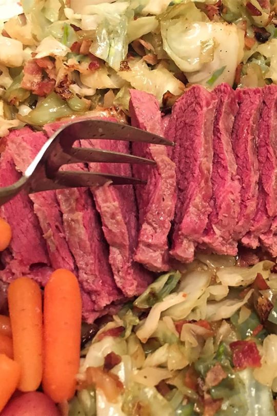 How long to cook corned beef in the oven, represented by close-up view of corned beef.