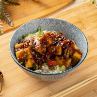 Close-up of tofu stirfry in a bowl.