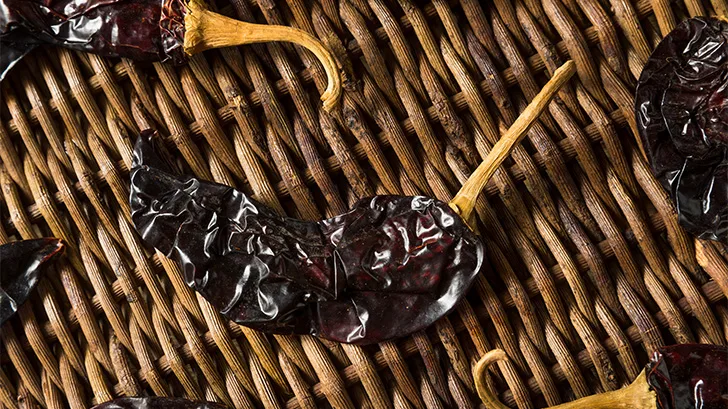 Guajillo pepper on top of basket.