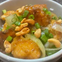 Close-up of prepared cashew chicken in bowl.