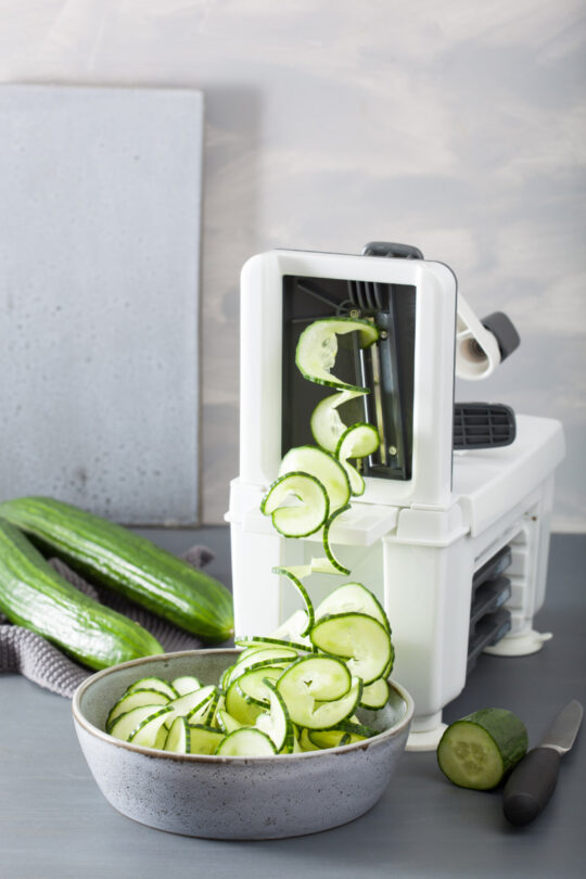 Spiralizer cuts cucumber into rounds.