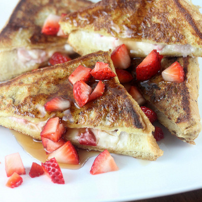 Strawberry cheesecake stuffed French toast on plate.