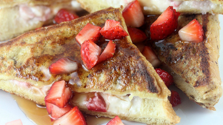 Strawberry cheesecake stuffed French toast on plate.