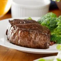 Filet mignon steak with broccoli -- steak and veggies -- on plate.