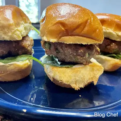 Chinese sliders prepared on blue plate.