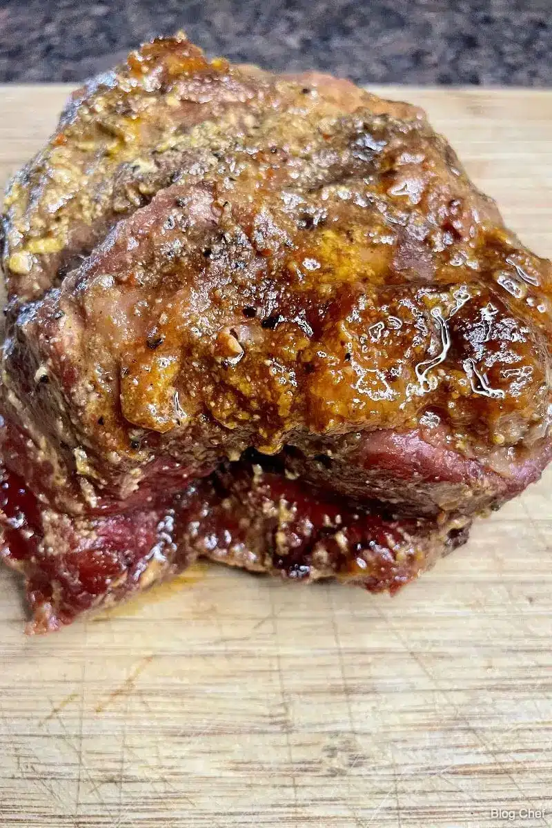 Smoked chuck tender roast on cutting board.