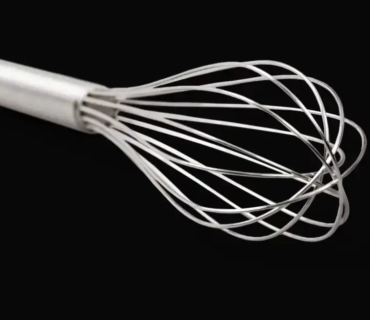 Whisk on black background.