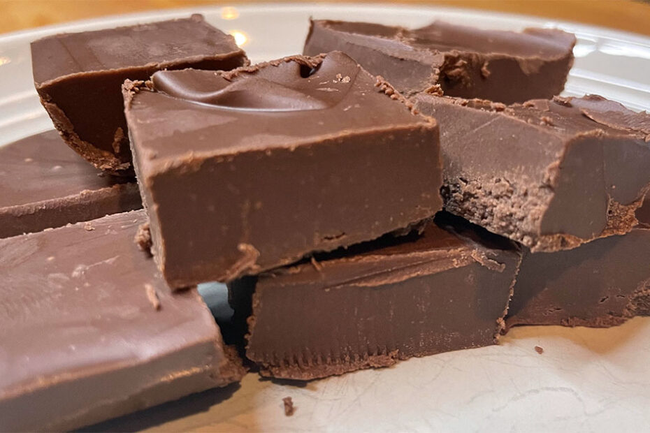 Squares of homemade easy chocolate fudge on plate.