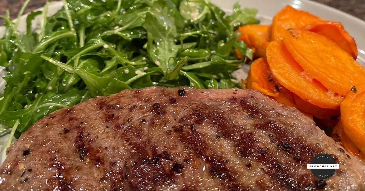 Reverse-sear steak served with arugula salad and carrots.