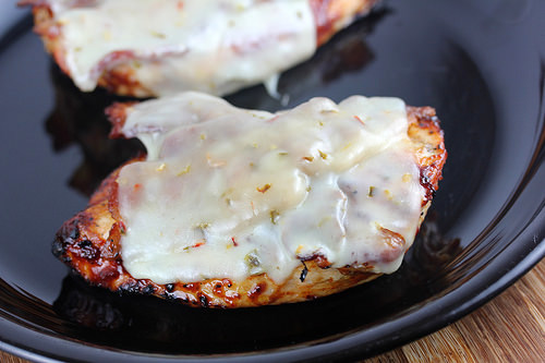 Close-up of BBQ chicken breast covered in melted pepper jack cheese