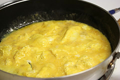 Scrambled eggs cooking in a skillet