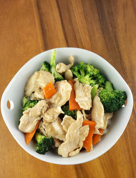 Bowl of chicken broccoli stir fry with carrots