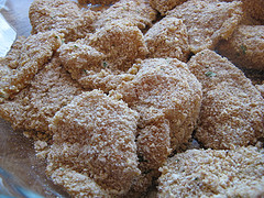 Breaded chicken pieces before frying