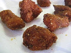 Close-up of fried chicken nuggets on paper towel