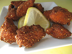 Pile of crunchy chicken nuggets with lemon slice