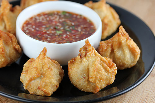 Crispy chicken wontons served with sesame dipping sauce