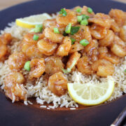 Chinese lemon pepper shrimp with rice and lemon slices