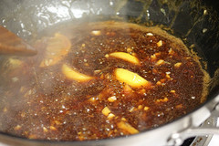 Pan with dark lemon garlic sauce cooking