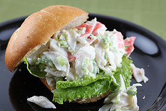 Crab salad sandwich served open-faced on lettuce