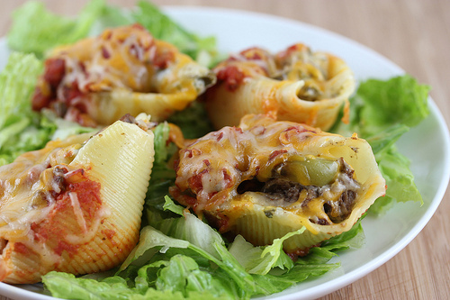 Close-up of cheesy fajita stuffed shells with beef and peppers