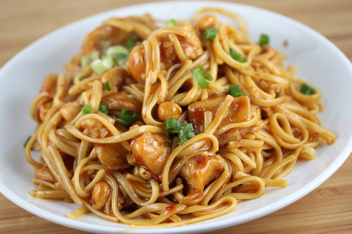 Kung pao linguine garnished with green onions