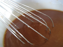 Brown sauce being whisked in bowl