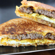 Breakfast patty melt sandwich with sausage, egg, and cheese on toasted bread