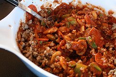Bowl of meat sauce with sausage, vegetables, and pepperoni