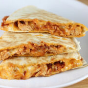 Stacked chicken tinga quesadilla slices filled with shredded chicken and melted cheese