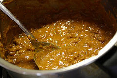 Pot of chili with melted cheese and beef mixture