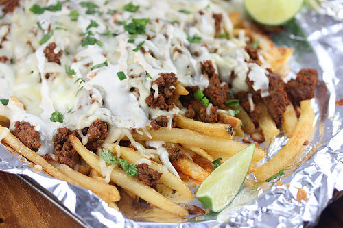 Crispy fries with seasoned chorizo, cheese, and cilantro