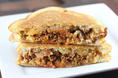 Chorizo grilled cheese sandwich with melted cheese on toasted bread