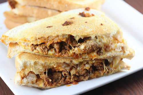 Chorizo grilled cheese sandwich with melted cheese on toasted bread
