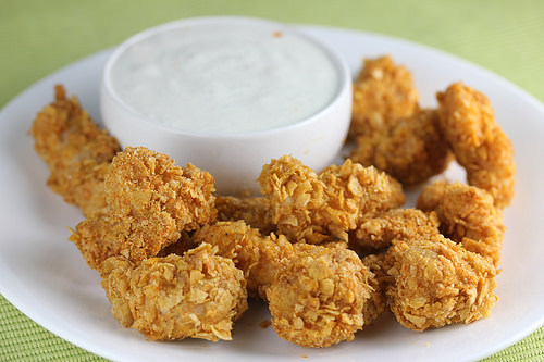 Crispy chicken poppers served with ranch dressing