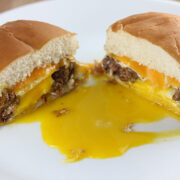 Egg in a hole burger with melted cheddar and runny yolk