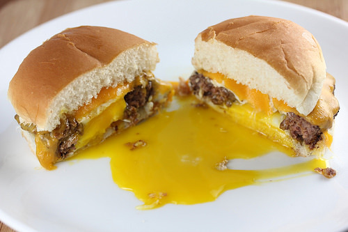 Egg in a hole burger with melted cheddar and runny yolk